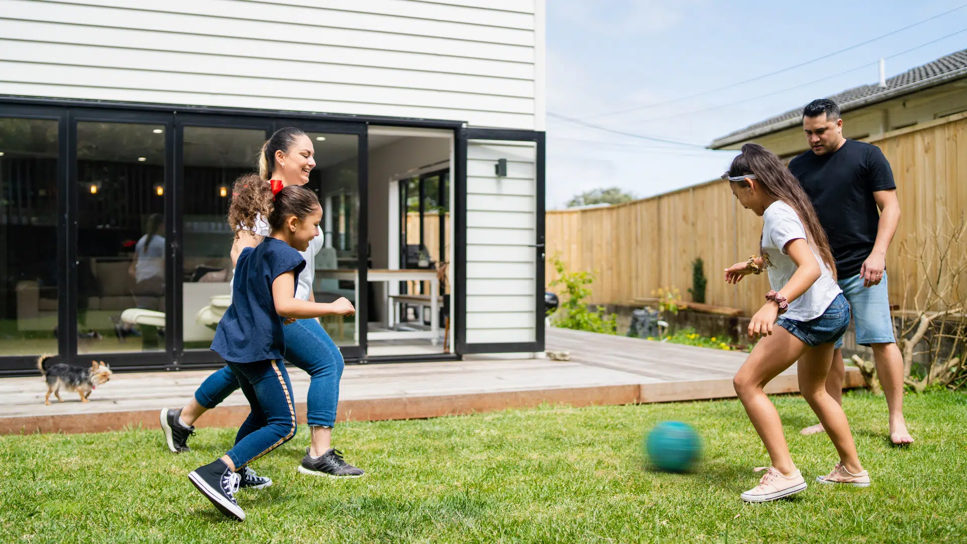 children playing outside with family