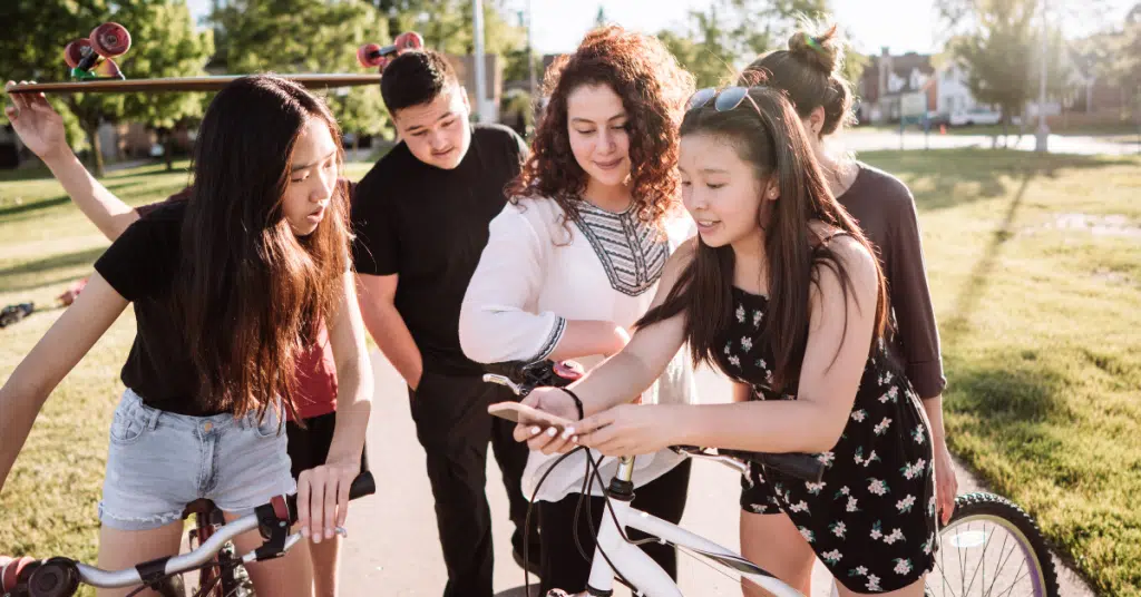 a group of teenagers outside during summer break