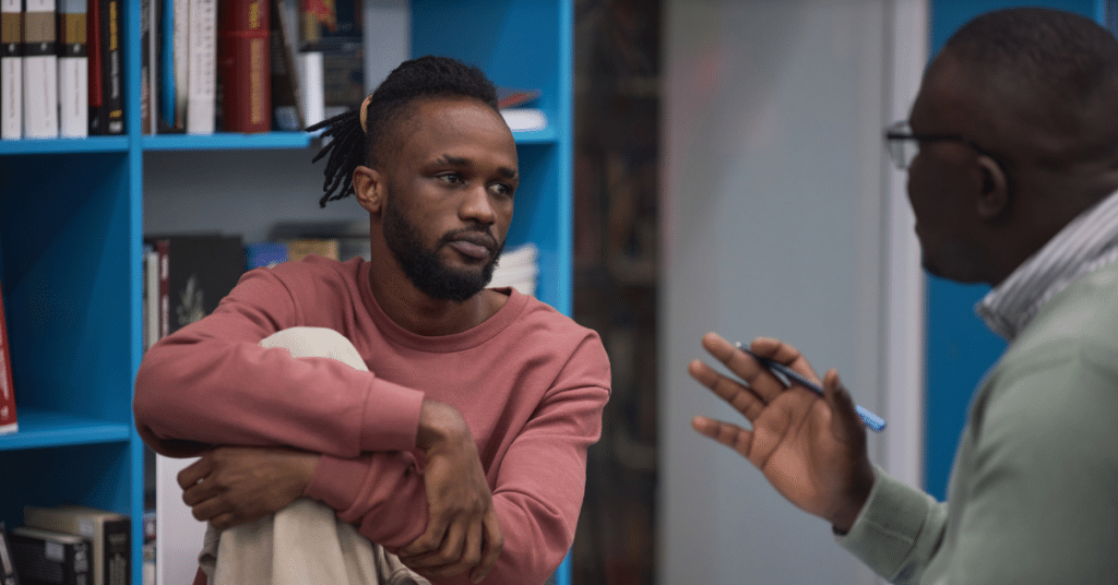 man talking to a therapist about feeling lonely and being depressed