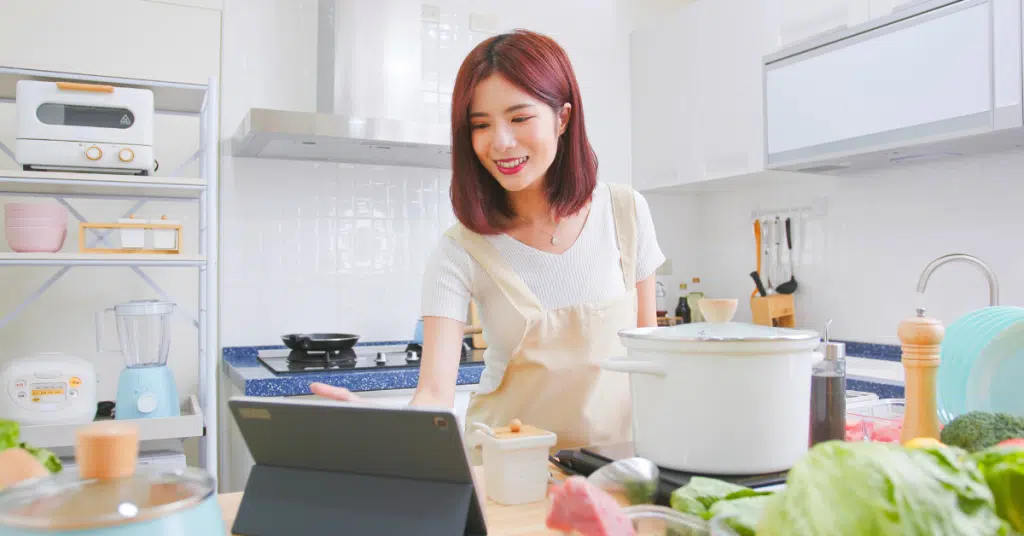 woman boosts mental health by bloomscrolling her hobbies in cooking