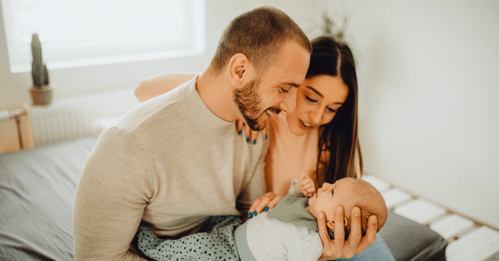 parents work together to care for their baby to help with some symptoms of mom brain