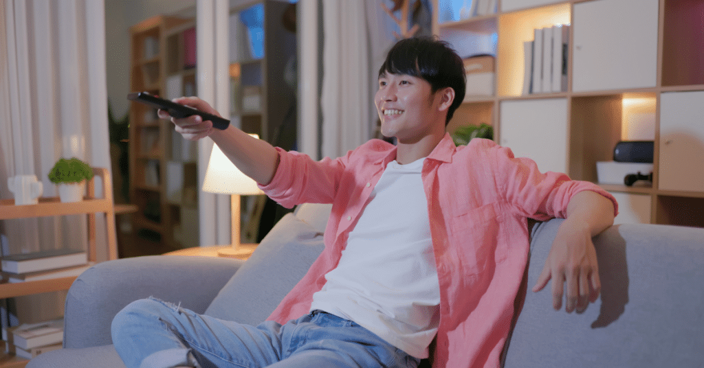 man turning on the tv to watch the same show over and over