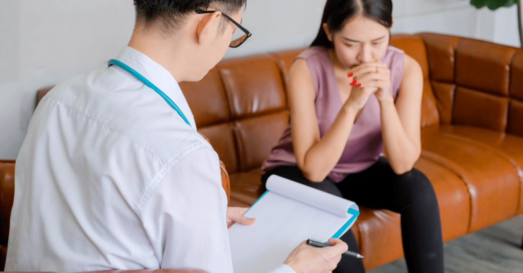 a woman is meeting with a psychologist and a psychiatrist as part of her care team