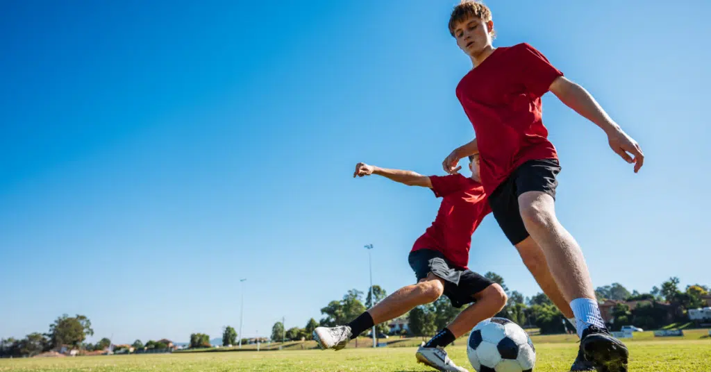 teen boys at soccer practice which helps well being